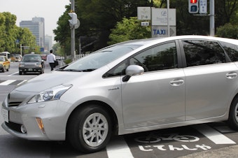 caption: Toyota says it will use a software update to fix an issue with some Prius models, saying certain conditions could result in their unexpectedly stalling. Here, a Prius is seen during a test drive in Tokyo in 2011.