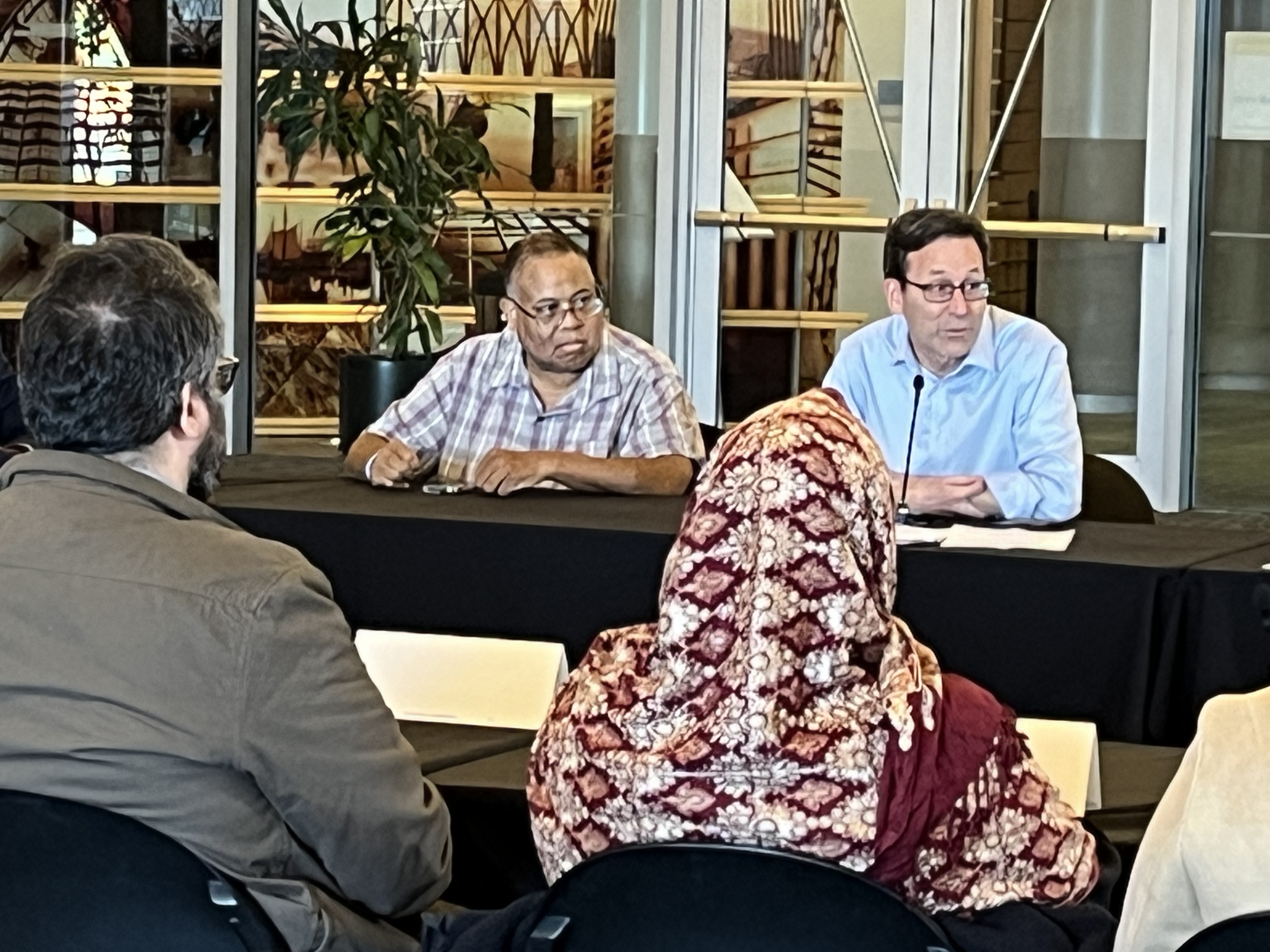 caption: Washington Rep. David Hackney and Gov. Bob Ferguson joined a roundtable to hear concerns from Somali American groups at Seattle City Hall on Monday, Dec. 29, 2025.