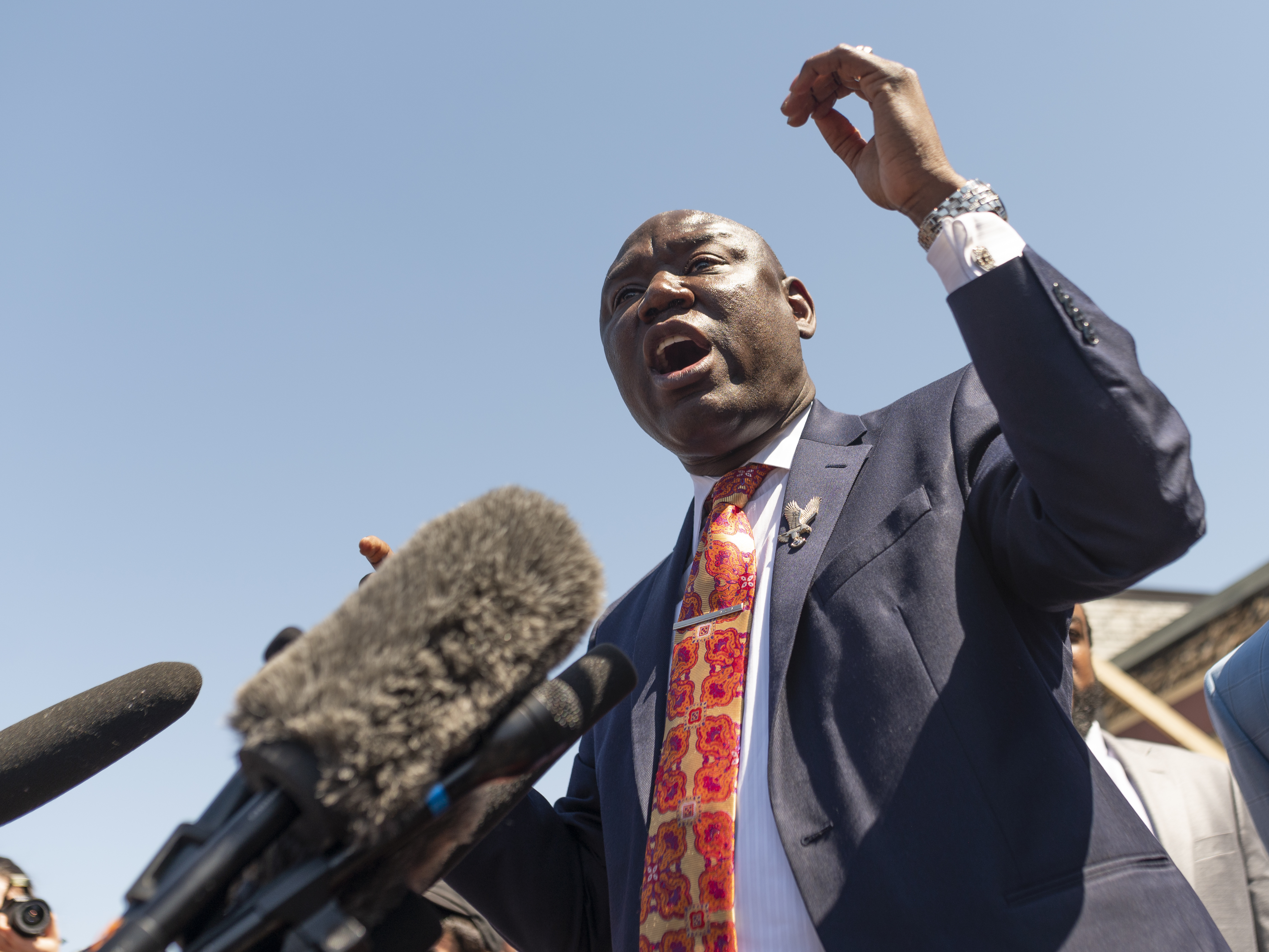 caption: Attorney Ben Crump speaks during a press conference at the site where George Floyd was killed in Minneapolis. Crump has represented numerous families of people killed by police.