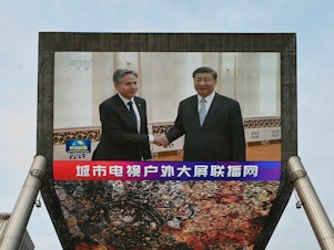 caption: A China Central Television news broadcast shows footage of U.S. Secretary of State Antony Blinken meeting with China's President Xi Jinping on Monday.