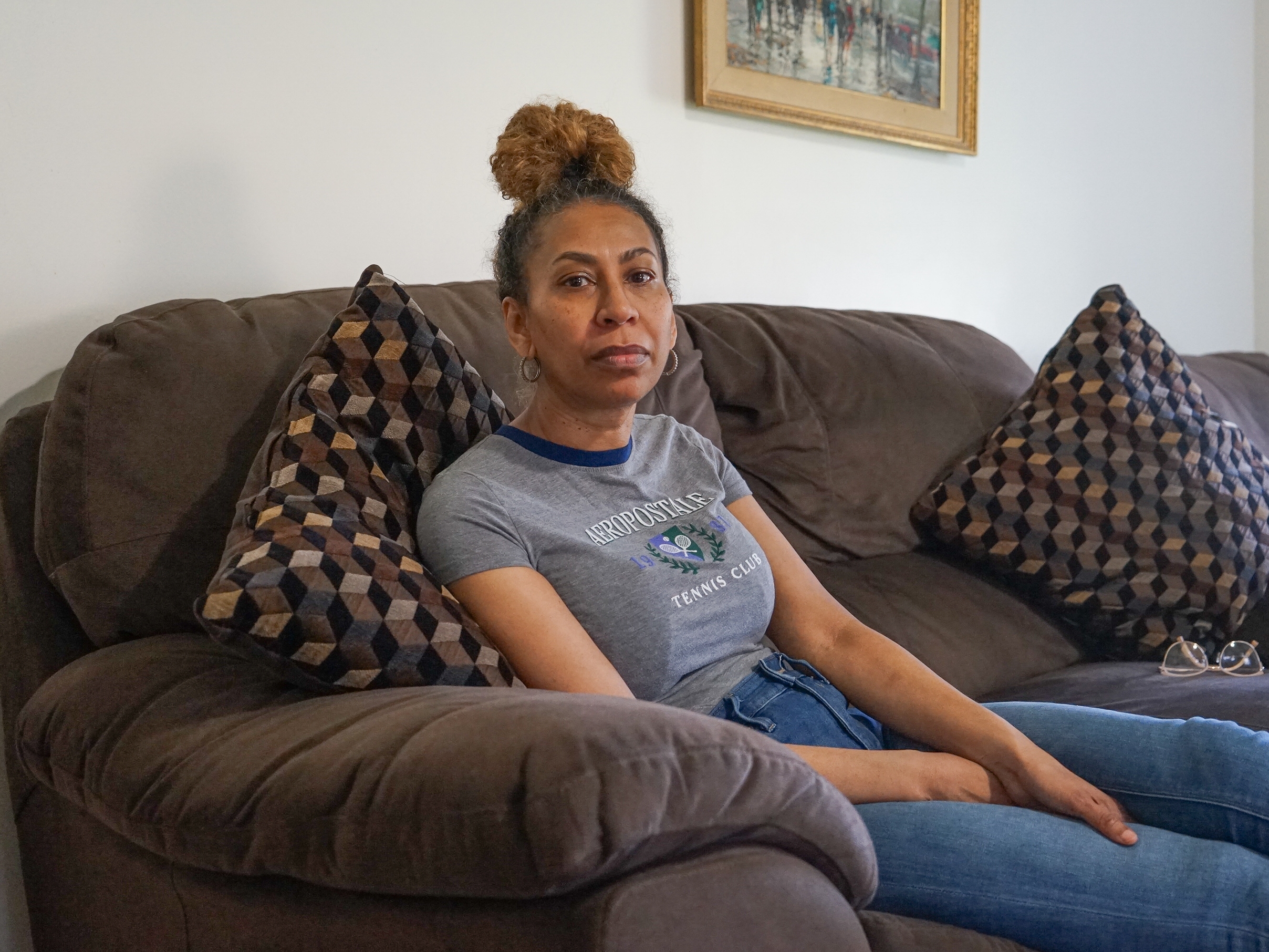 caption: Debra Ragoonanan, a nursing assistant, says she has endured PTSD after COVID killed dozens in 2020 at the Massachusetts veterans facility where she still works. The state agreed to a $56 million settlement for veterans and their families, but caretakers have gotten little assistance. 