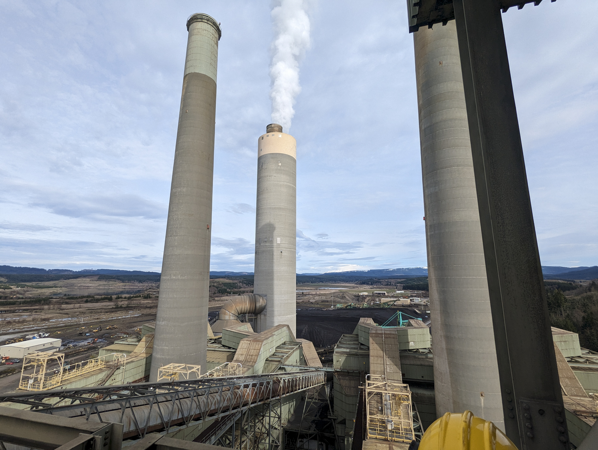caption: TransAlta's coal-burning power plant in Centralia, Washington, emits steam and invisible pollutants on March 7, 2024.