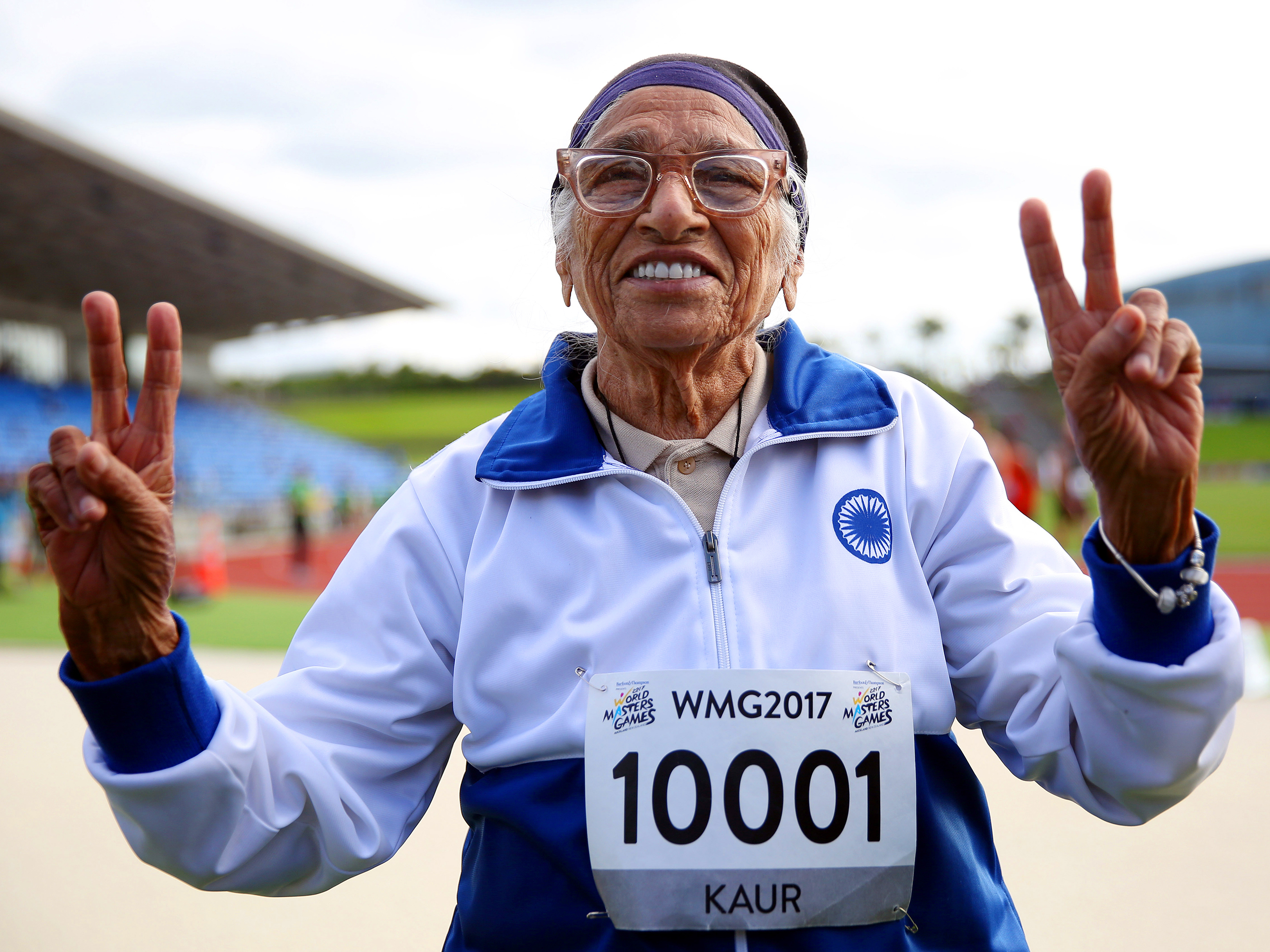 caption: Man Kaur of India celebrates after competing in the 100-meter sprint in the 100+ age category at the World Masters Games in Auckland, New Zealand, in April 2017.