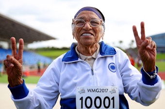 caption: Man Kaur of India celebrates after competing in the 100-meter sprint in the 100+ age category at the World Masters Games in Auckland, New Zealand, in April 2017.