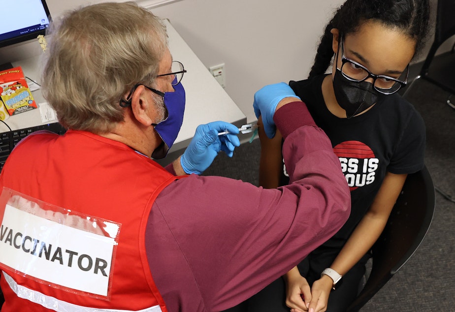 caption: Pfizer will submit new data to the FDA this week about trials of its vaccine for kids younger than 5 years old. Here, an older child receives the Pfizer BioNTech COVID-19 vaccine in Virginia last November.