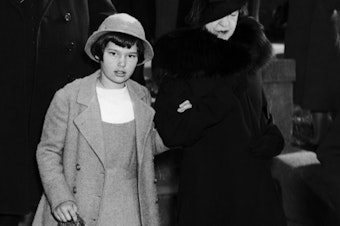 caption: A young Gloria Vanderbilt appears in Long Island, N.Y., with her aunt, Gertrude Vanderbilt Whitney, in 1934, the same year Whitney fought for custody of the heiress.