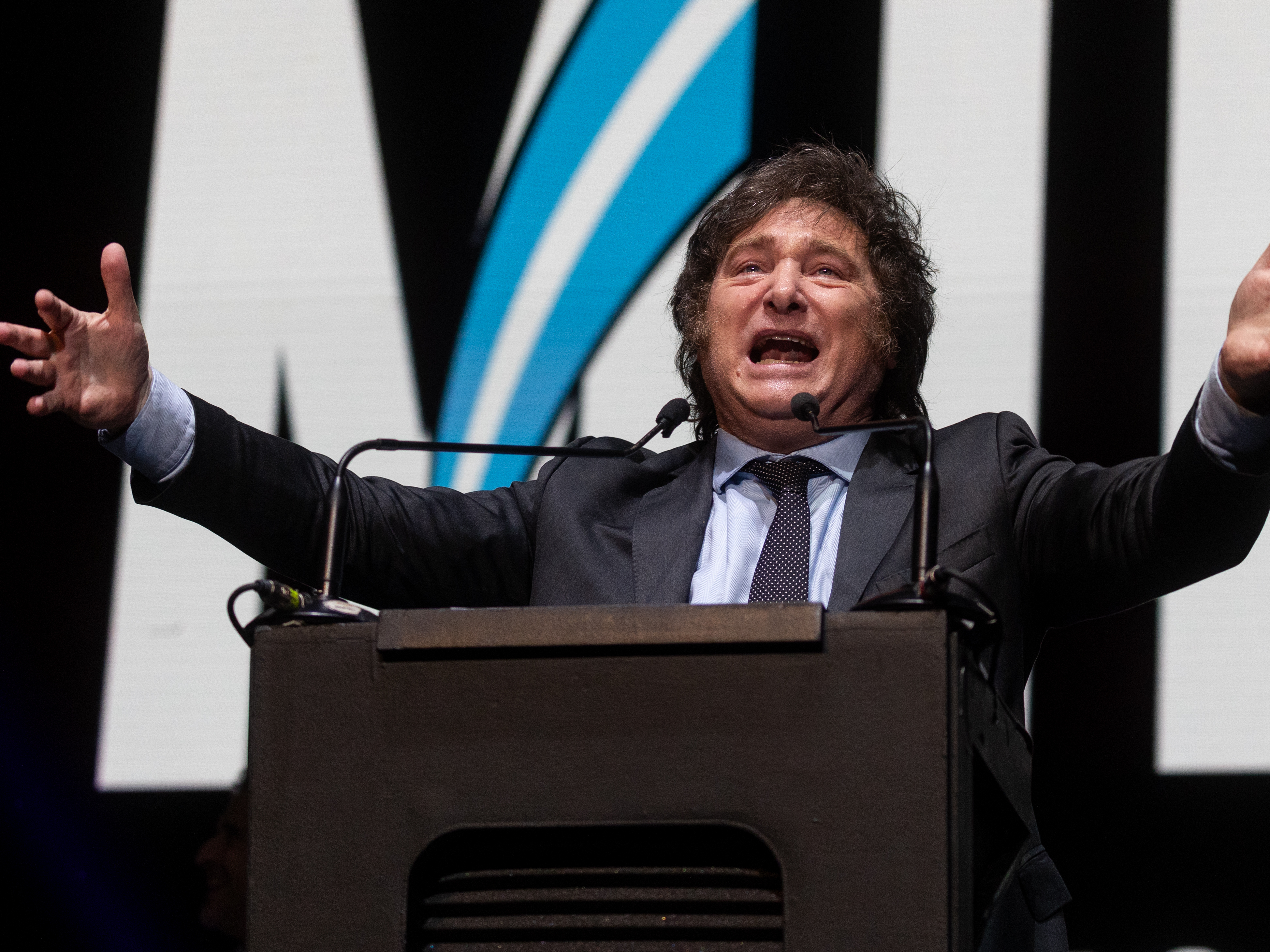 caption: Javier Milei of La Libertad Avanza speaks to supporters during his closing rally at Movistar Arena on Oct. 18 in Buenos Aires.