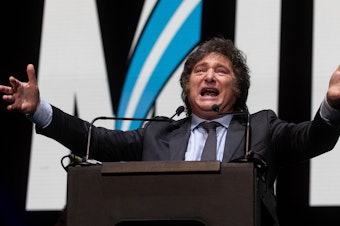 caption: Javier Milei of La Libertad Avanza speaks to supporters during his closing rally at Movistar Arena on Oct. 18 in Buenos Aires.