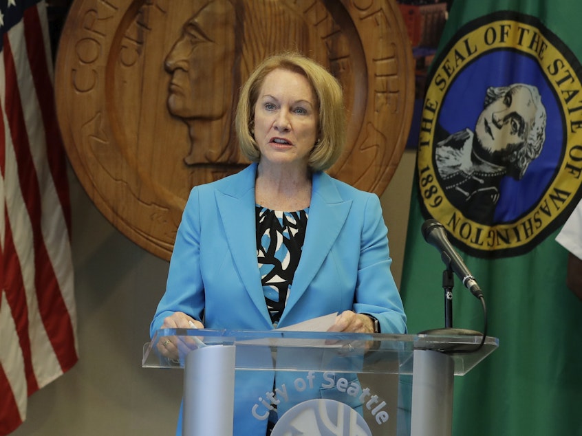 caption: Seattle Mayor Jenny Durkan speaks at a news conference during the summer of 2020. Durkan and the governor of Washington state told reporters that U.S. officers sent to protect federal buildings in the city have left.
