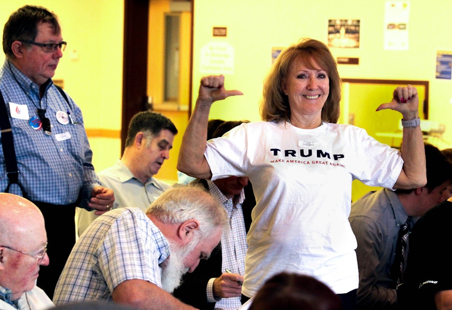 caption: Barbara Hagstrom of Duvall shows off her Trump t-shirt at the 5th Legislative District GOP Caucus last month. 