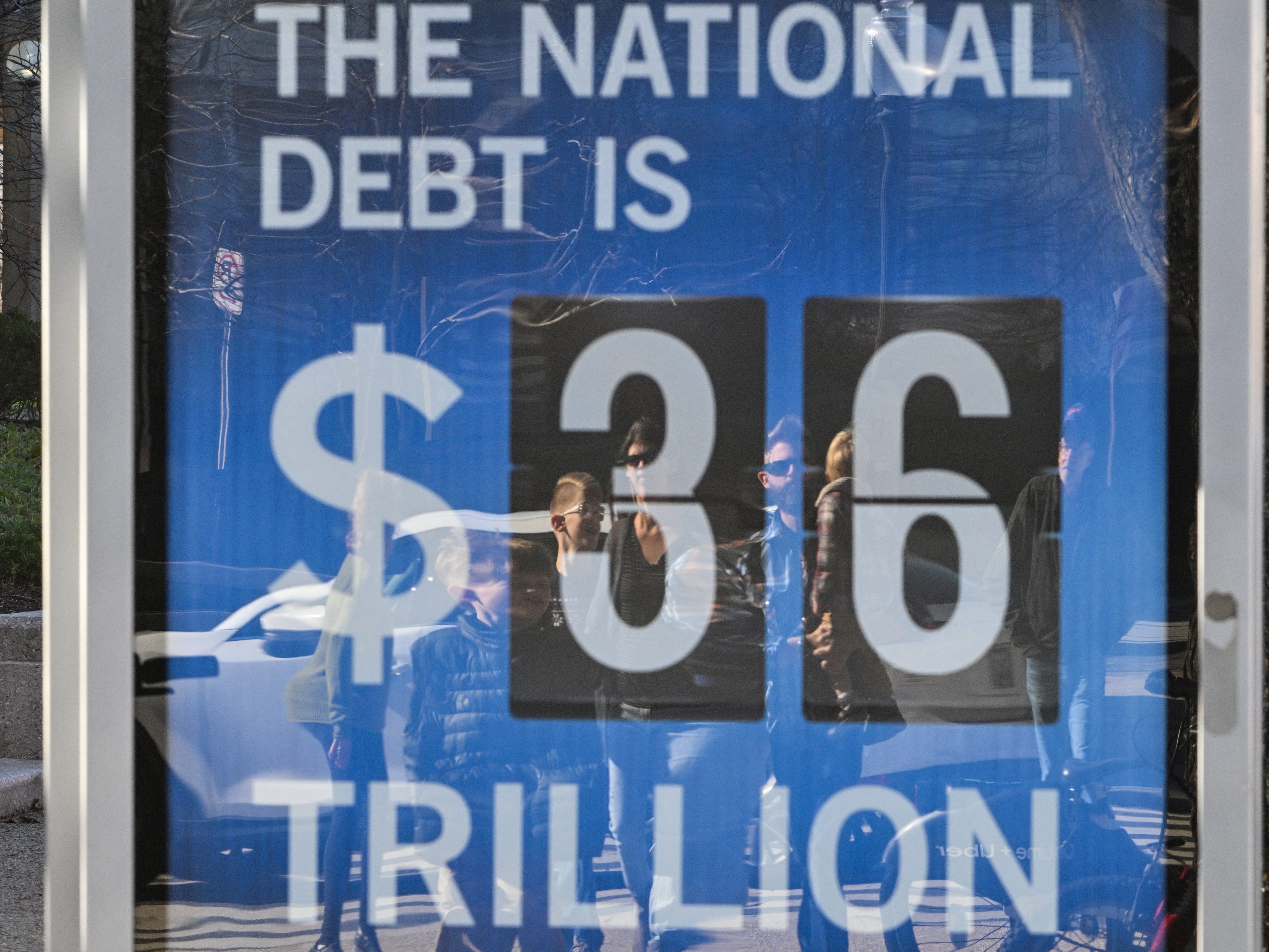 caption: Revenue raised by President Trump's tariffs could reduce federal deficits by $2.8 trillion over the next decade, according to a new forecast from the non-partisan Congressional Budget Office.