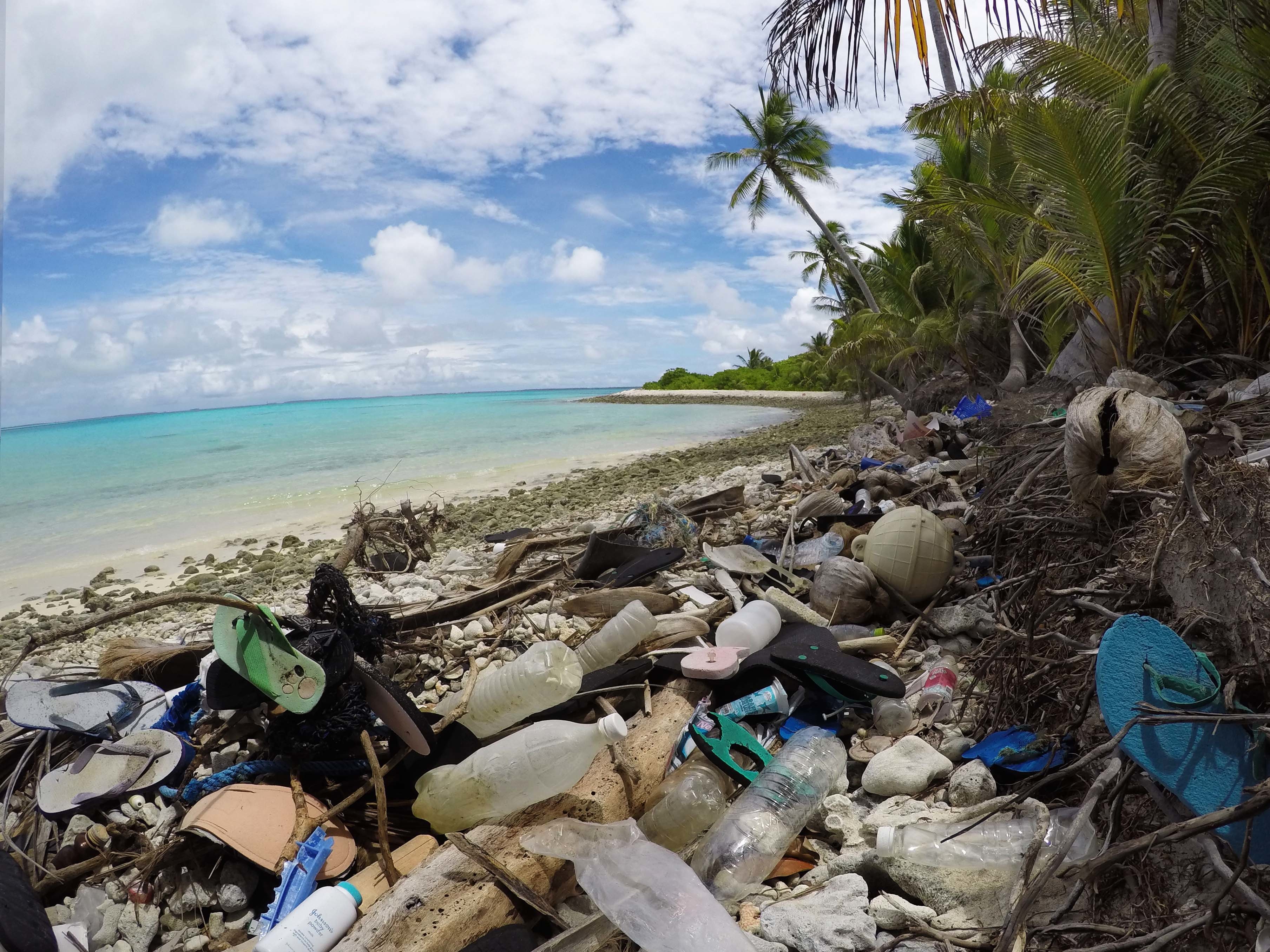caption: Debris blankets the north side of one of the Cocos Keeling Islands in the Indian Ocean. Researchers found a huge amount of plastic both on shore and buried in the sand.