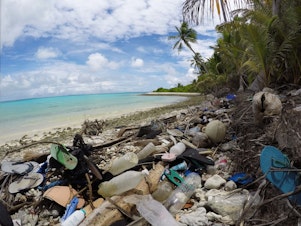 caption: Debris blankets the north side of one of the Cocos Keeling Islands in the Indian Ocean. Researchers found a huge amount of plastic both on shore and buried in the sand.