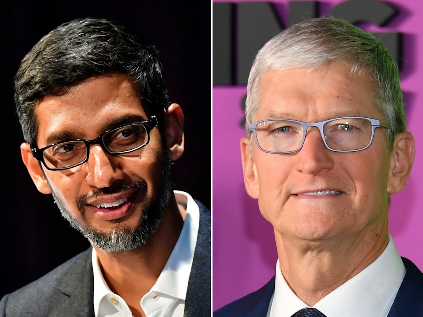 caption: The Justice Department says Google CEO Sundar Pichai (left) met privately with Apple chief Tim Cook in 2018 to discuss how their two companies could collaborate.