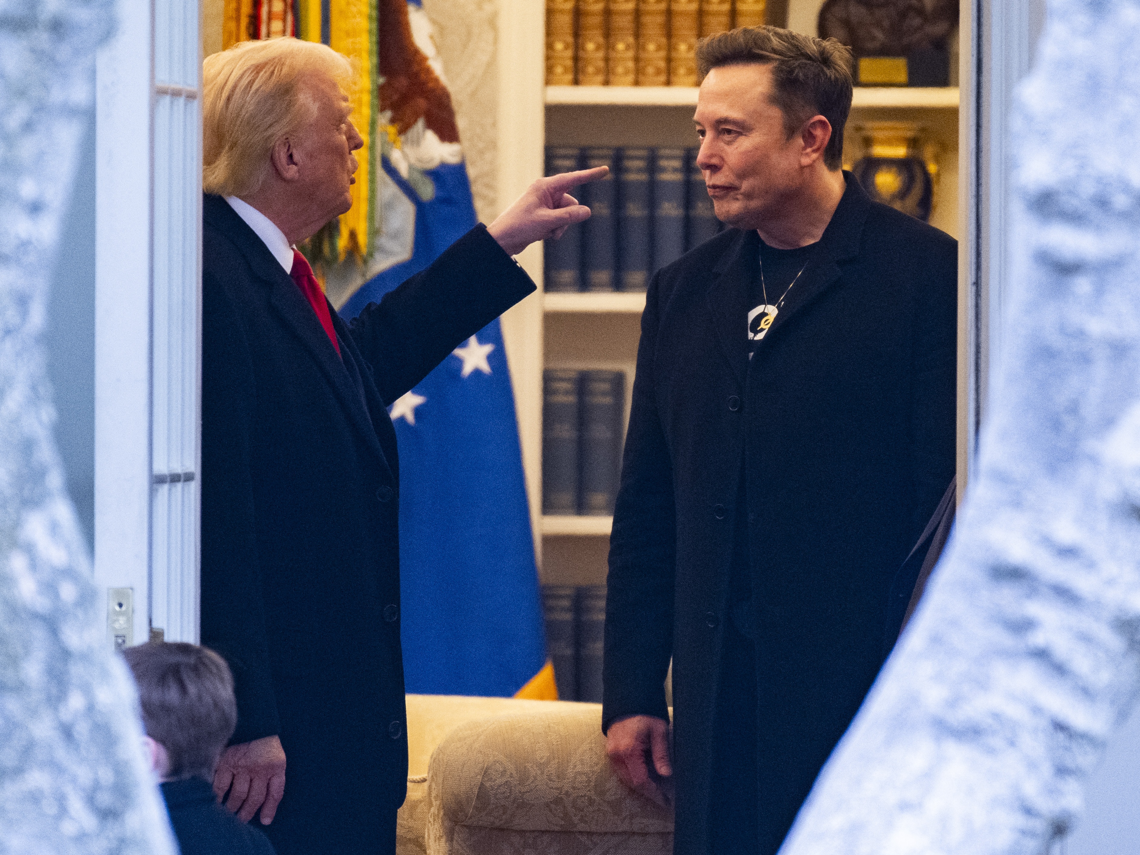 caption: President Trump and his adviser Elon Musk speak before departing the White House on his way to his South Florida home in Mar-a-Lago on March 14.