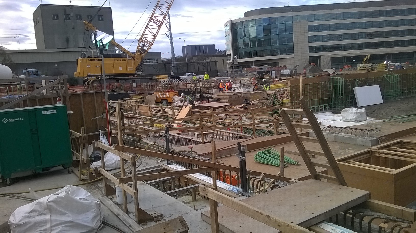 caption: The job site where a wall collapsed on Thursday, sending four workers hurtling 25 feet to the ground. The accident resulted in a broken arm, scrapes, bruises and stiff necks.