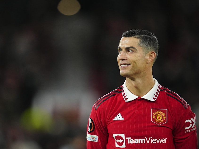 caption: Cristiano Ronaldo smiles before the start of Manchester United's match against Sheriff at Old Trafford in Manchester, England, on Oct. 27.