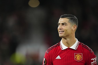 caption: Cristiano Ronaldo smiles before the start of Manchester United's match against Sheriff at Old Trafford in Manchester, England, on Oct. 27.