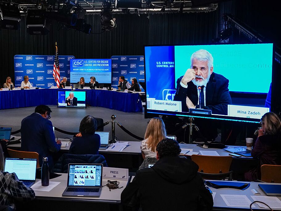caption: Dr. Robert Malone speaks during a meeting of the CDC Advisory Committee on Immunization Practices at CDC Headquarters on December 4, 2025 in Atlanta, Ga.