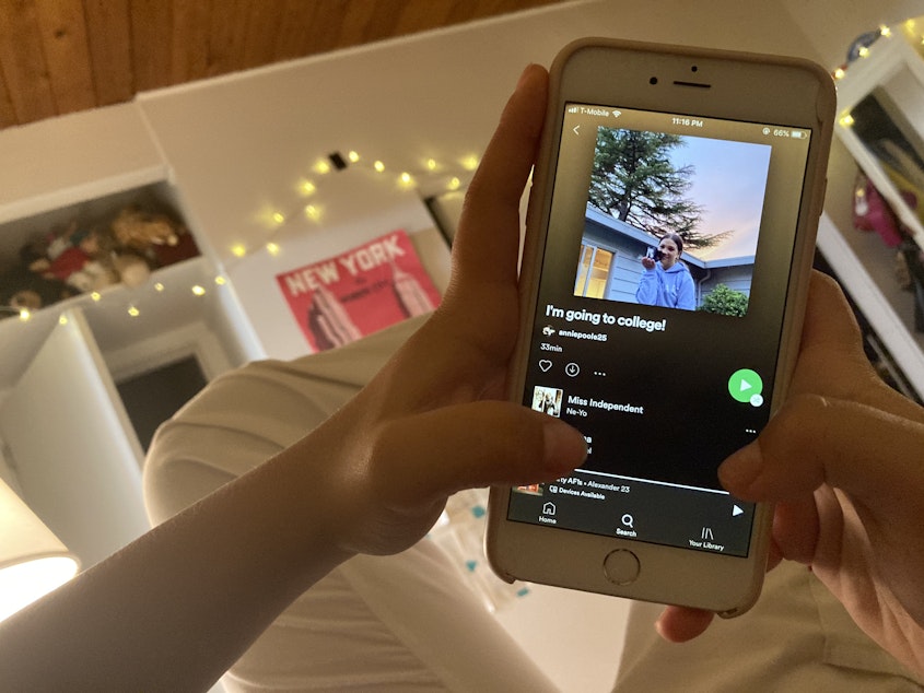 caption: Following the virtual graduation ceremony, Annie Poole, a graduate of Mercer Island High School Class of 2020, lays in her bedroom listening to her Spotify playlist titled “I’m going to college!” Instead of the celebratory parties that typically follow the graduation ceremony, Poole found herself using this time to reflect. For Poole, “graduation was definitely memorable, yet anti-climactic at the same time,” because it felt like “high school never had real closure.”