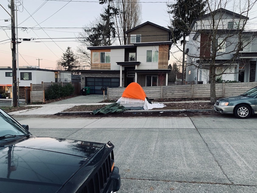 caption: A tent on a parking strip in Greenwood near Aurora Ave. Photo submitted to Seattle's Find It, Fix It app March 9, 2019. 
