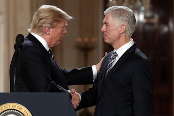 caption: President Donald Trump shakes hands with 10th U.S. Circuit Court of Appeals Judge Neil Gorsuch, his choice for Supreme Court associate justice in the East Room of the White House in Washington, Tuesday, Jan. 31, 2017. 