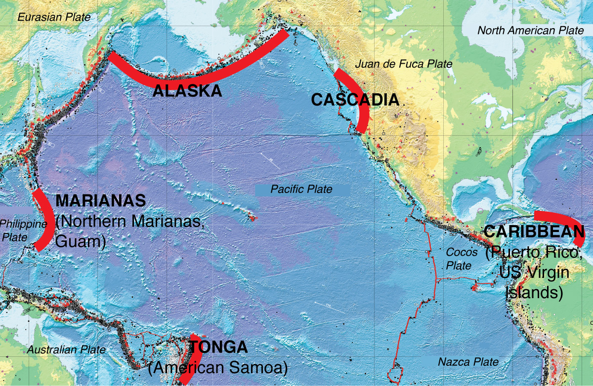 caption: Tectonic plates collide at Pacific Ocean “Ring of Fire” subduction zones, with subduction spots in U.S. territories highlighted in red, generating volcanos, earthquakes, and tsunamis. 