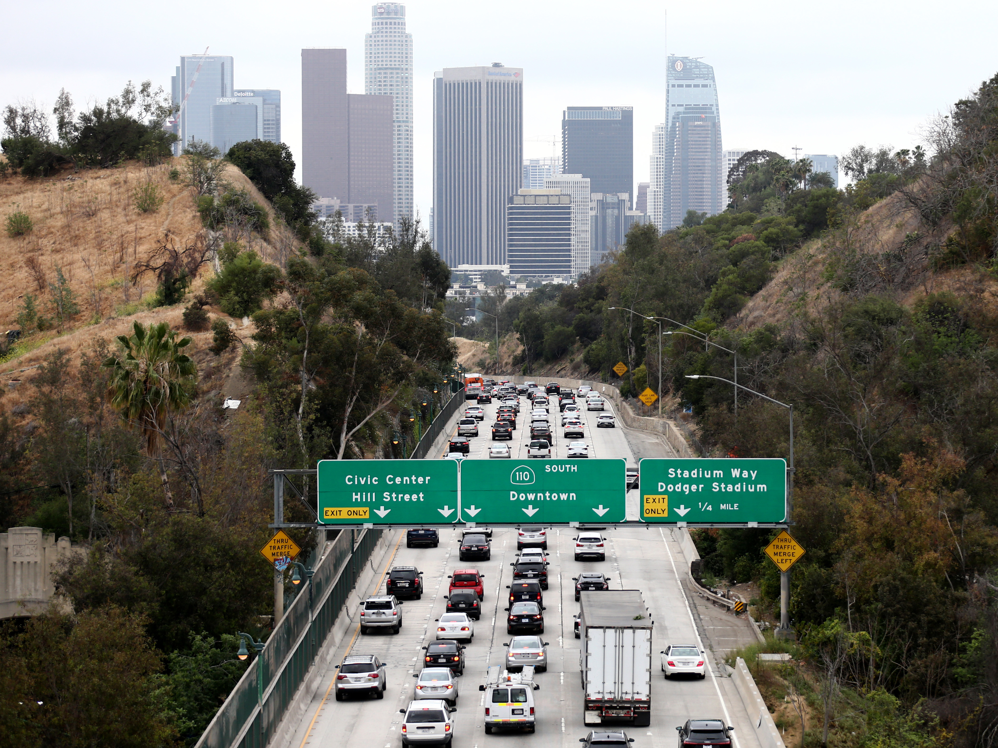 caption: Cars make their way toward downtown Los Angeles on April 22. California could regain the right to set its own vehicle emissions standards after the Environmental Protection Agency announced it was moving to curb a Trump-era policy that sought to erode the state's previously-held power.