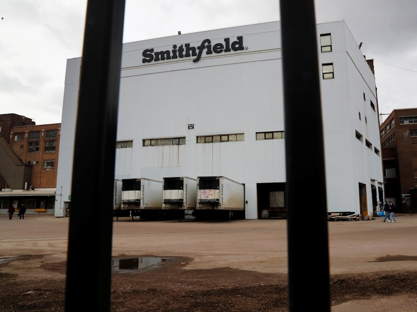 caption: Hundreds of workers tested positive for COVID-19 at a Smithfield Foods hog-processing plant in Sioux Falls, S.D.