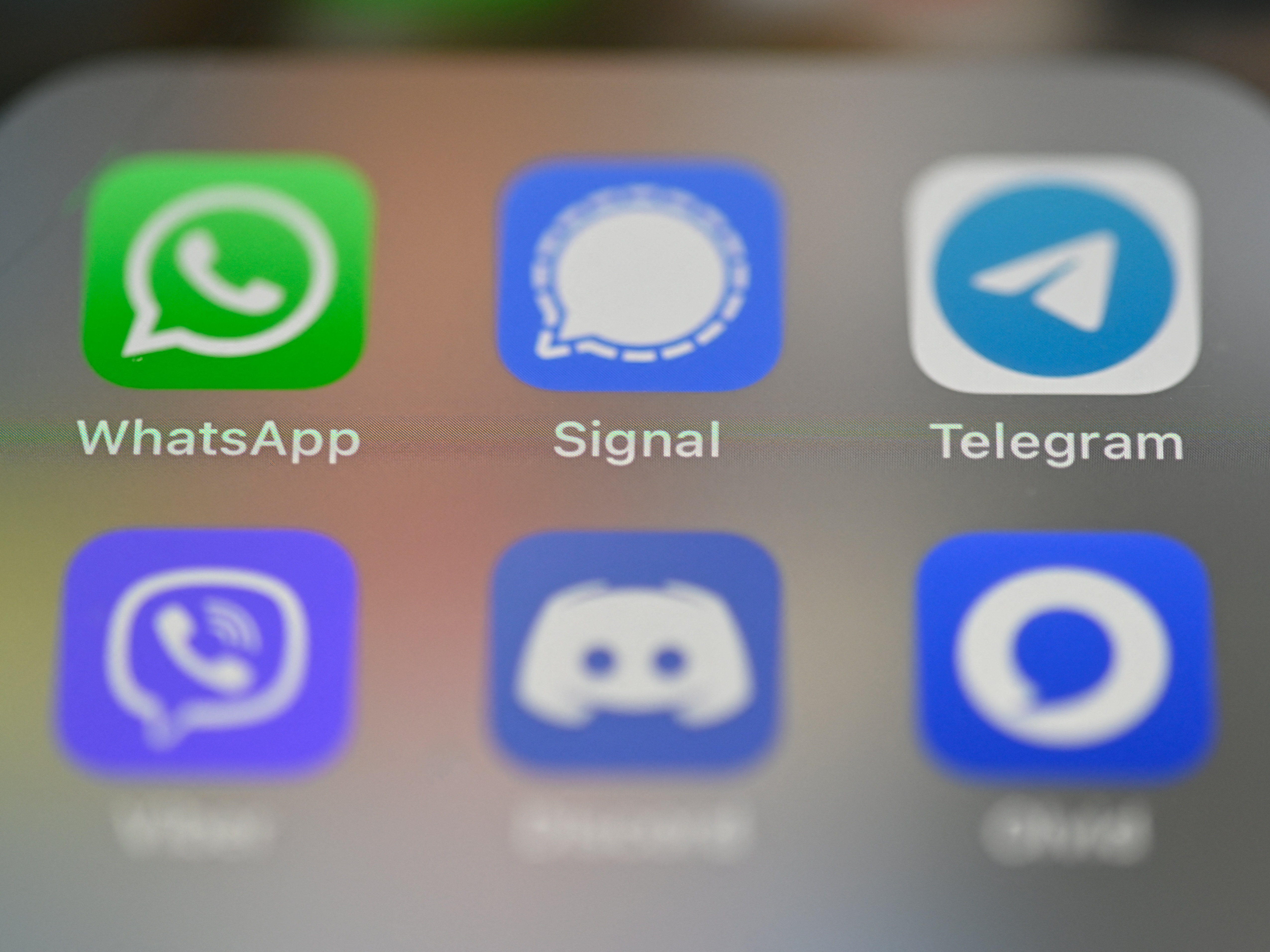 caption: The FBI and other agencies are encouraging people to use end-to-end encryption, citing what they say is a sustained hacking operation linked to China. In this 2021 photo, a smartphone's screen shows messaging apps including WhatsApp, Signal and Telegram.