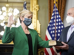 caption: Jennifer Granholm is sworn in as energy secretary Thursday. Granholm told NPR that pivoting to a clean energy economy could ensure a dependable grid and help create jobs.