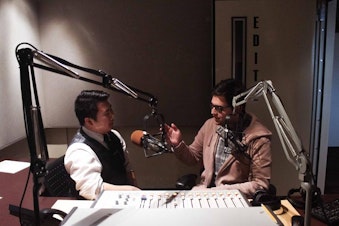 caption: Hosts Brian Freeland and Diego Villarroel in the studio.
