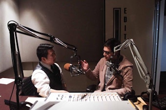 caption: Hosts Brian Freeland and Diego Villarroel in the studio.
