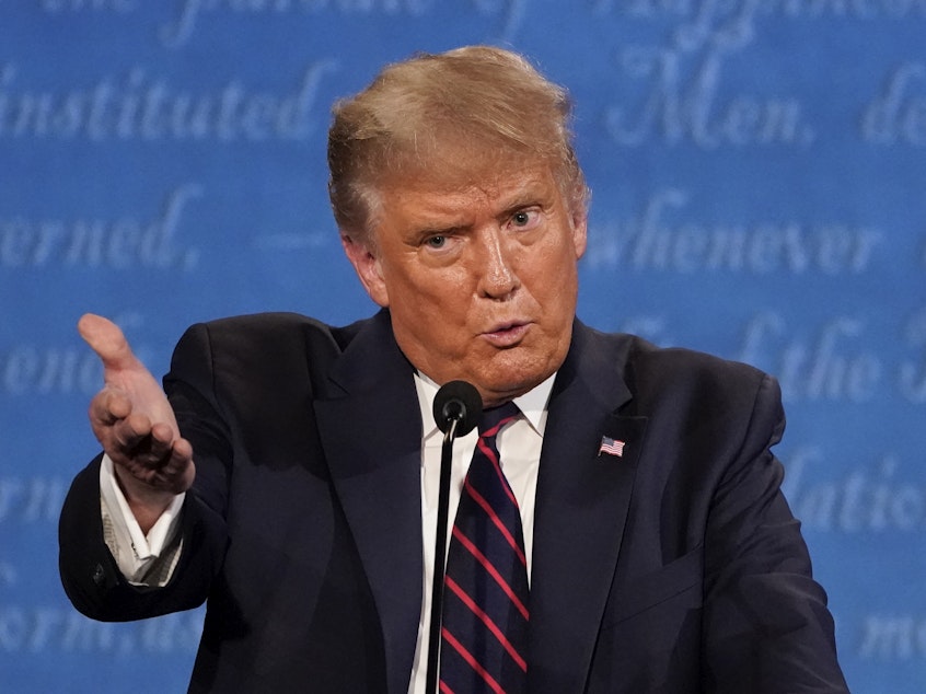 caption: President Trump gestures while speaking during the first presidential debate on Tuesday, at Case Western University and Cleveland Clinic, in Cleveland.