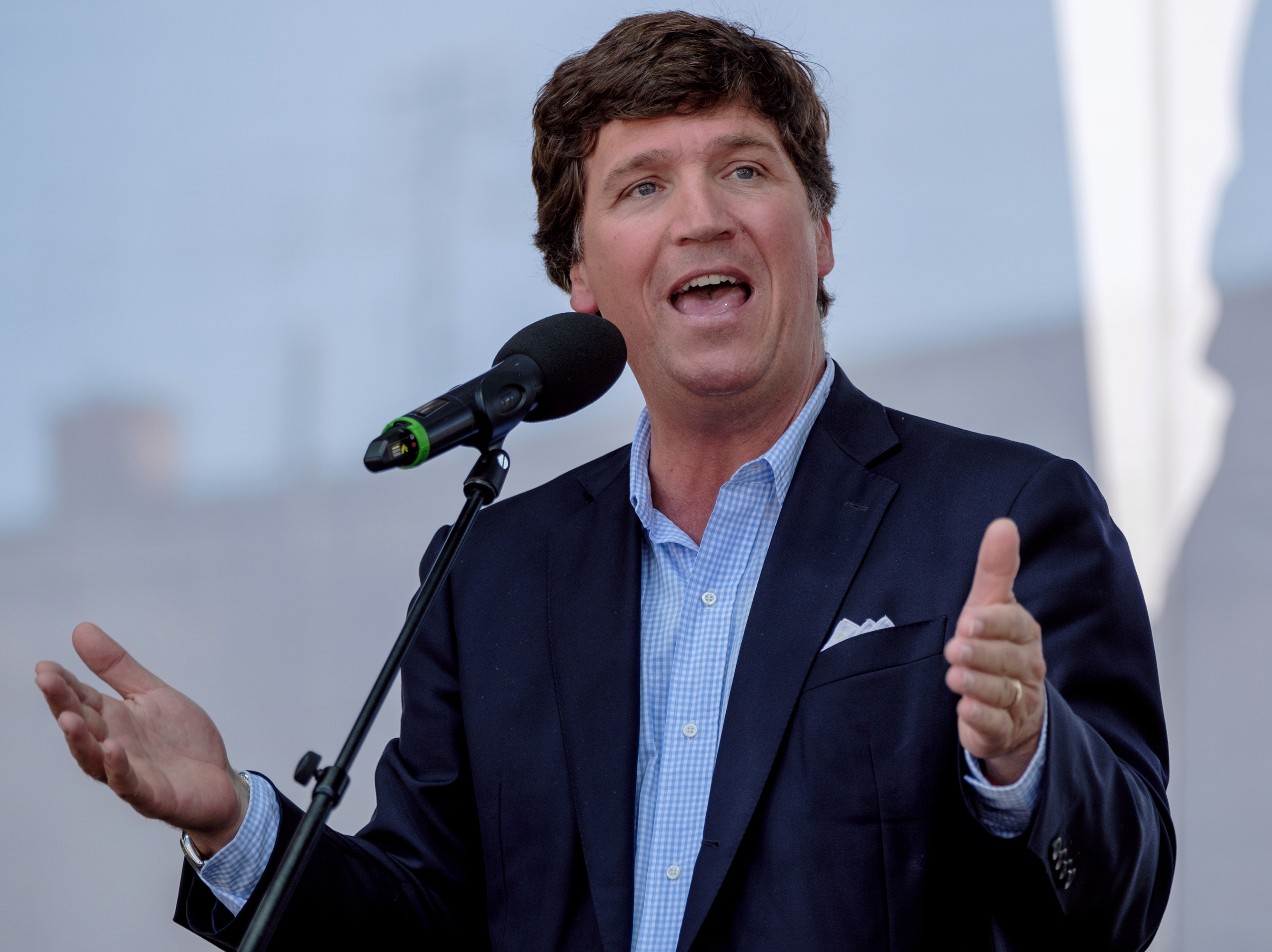 caption: Tucker Carlson speaks during the Mathias Corvinus Collegium (MCC) Feszt last summer in Esztergom, Hungary.