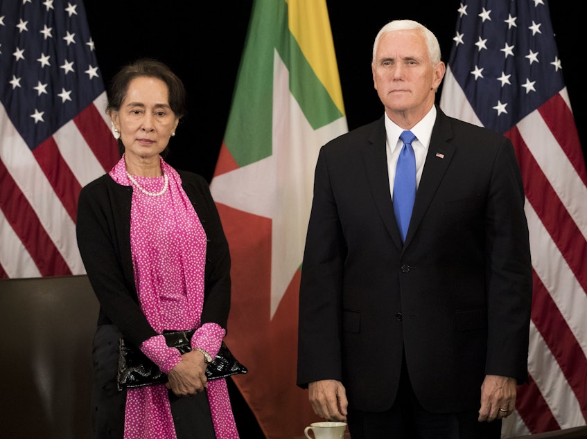 caption: Vice President Mike Pence and Myanmar State Counsellor Aung San Suu Kyi arrive for a bilateral meeting on the sidelines of the Association of Southeast Asian Nations (ASEAN) summit in Singapore on Wednesday.
