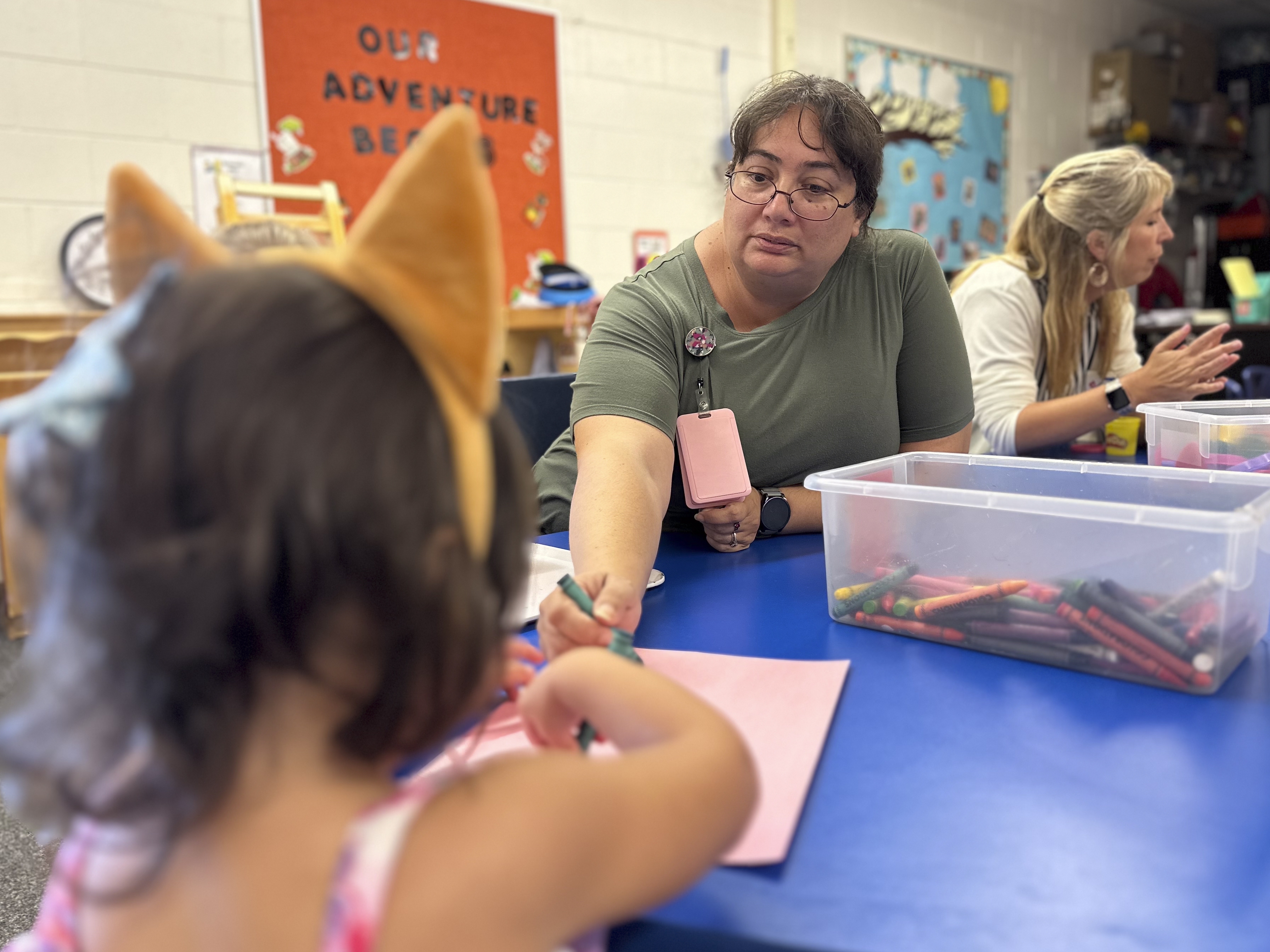 caption: Julie Beck earns roughly $20 an hour teaching in Head Start classrooms 10 months a year. “I'm paycheck to paycheck,” she says.