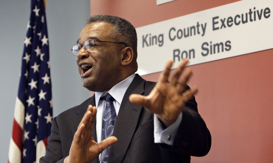 caption: FILE: Ron Sims speaks at a news conference where he announced that President Barack Obama will nominate him to be deputy secretary of the U.S. Department of Housing and Urban Development, Monday, Feb. 2, 2009, in Seattle. 