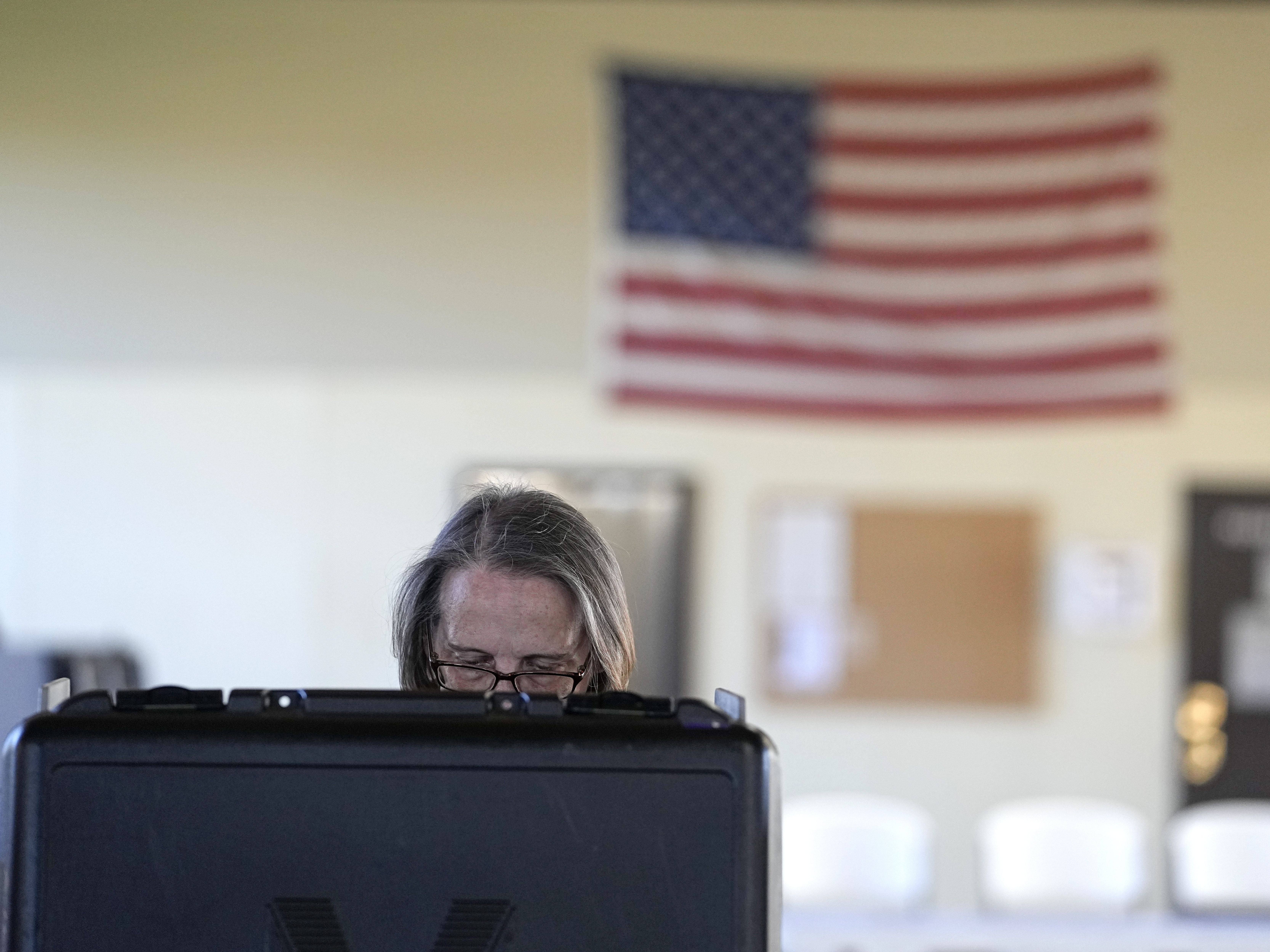 caption: A voter cast her vote at the Lake County Fairgrounds on Nov. 8, 2022, in Crown Point, Ind.
