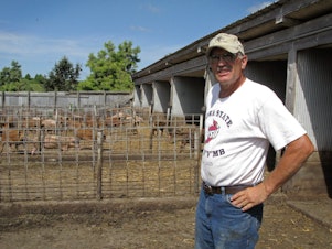 caption: Ron Rosmann, shown here in 2011, raises hogs and grows crops organically near Harlan, Iowa.
