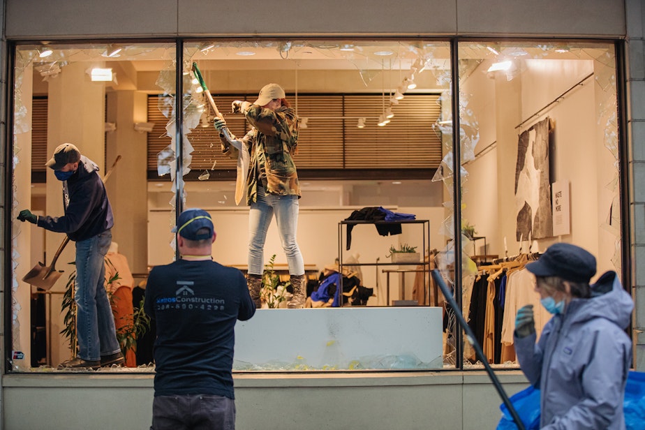 caption: The outside of a downtown Seattle retail store after a night of protests on Saturday, May 30. The protests were in opposition of police violence, and specifically the death of George Floyd at the hands of police.