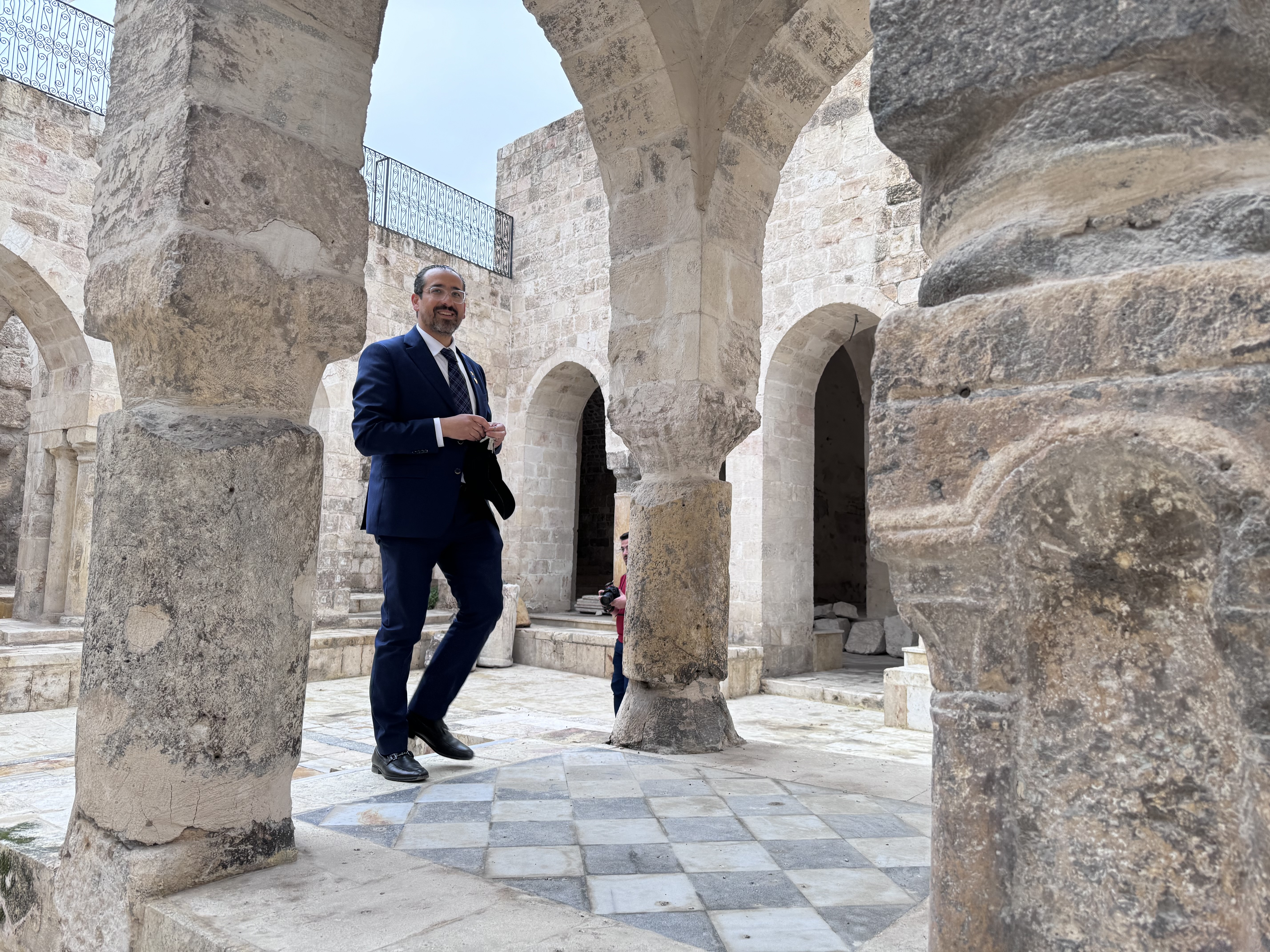 caption: Syrian-American cantor Henry Hamra at the Central Synagogue of Aleppo, once the center of a thriving Jewish community in the northern Syrian city. The Syrian government transferred control of Jewish sites in December to Hamra's Jewish heritage organization.