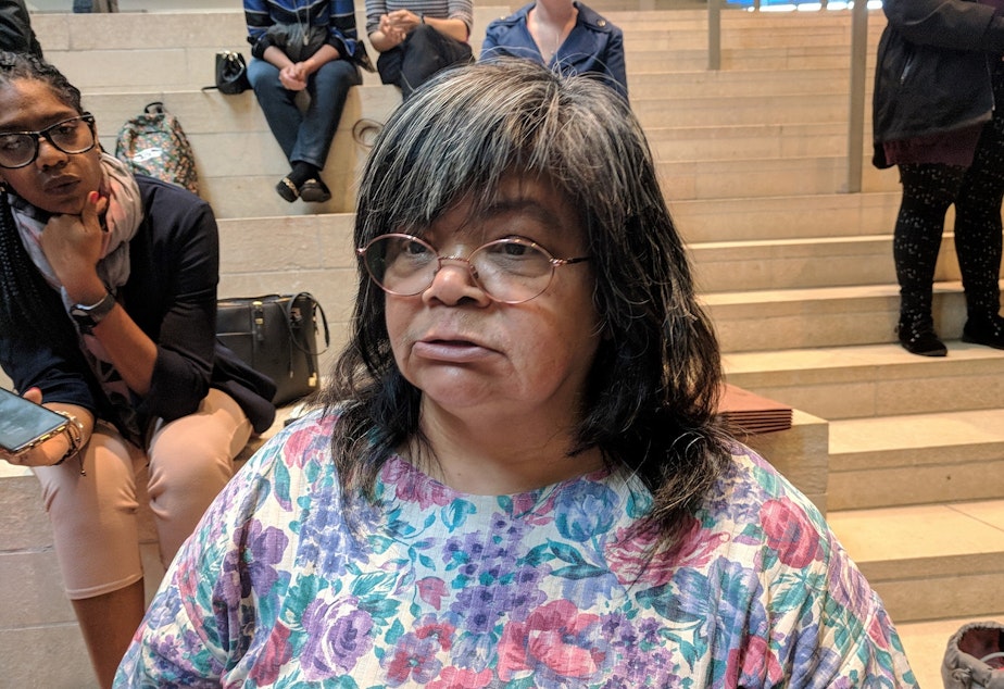 caption: Gina Owens became homeless within a month of being evicted a few years ago. She spoke at a press conference about a study on the human cost of evictions at Seattle City Hall, Sept. 20, 2018.