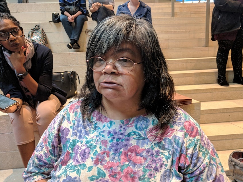 caption: Gina Owens became homeless within a month of being evicted a few years ago. She spoke at a press conference about a study on the human cost of evictions at Seattle City Hall, Sept. 20, 2018.