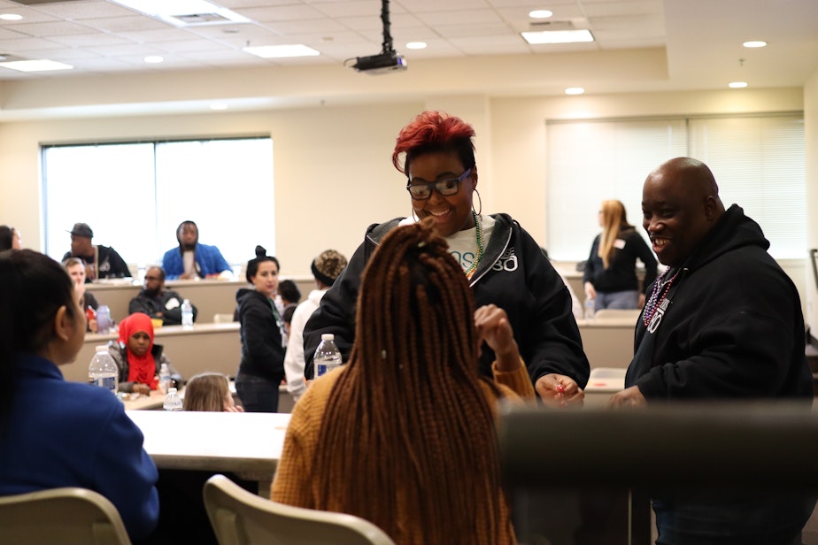 caption: Lady Jay Hunter (left) and Allen Hunter speak with participants at a Choose 180 Youth Diversion Workshop. 