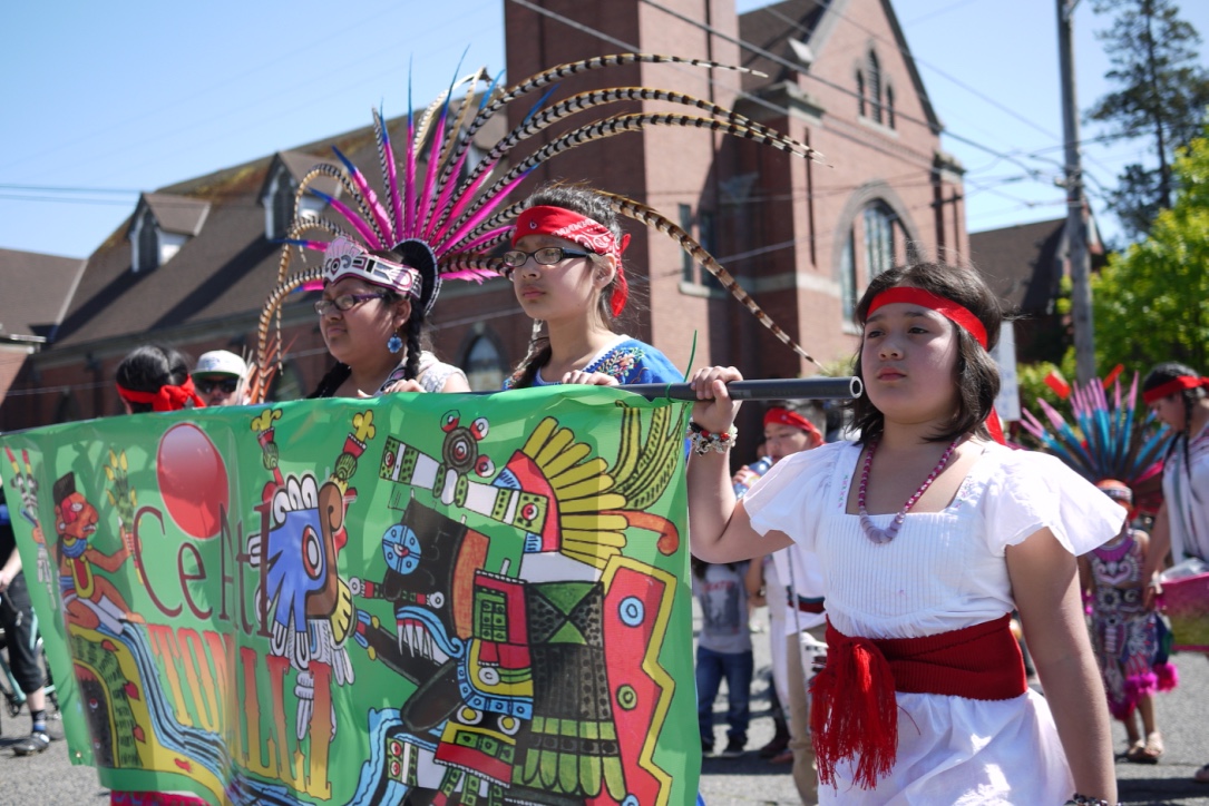 caption: Marchers at a May Day march in downtown Seattle on Sunday. 
