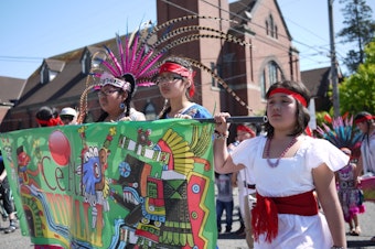 caption: Marchers at a May Day march in downtown Seattle on Sunday. 