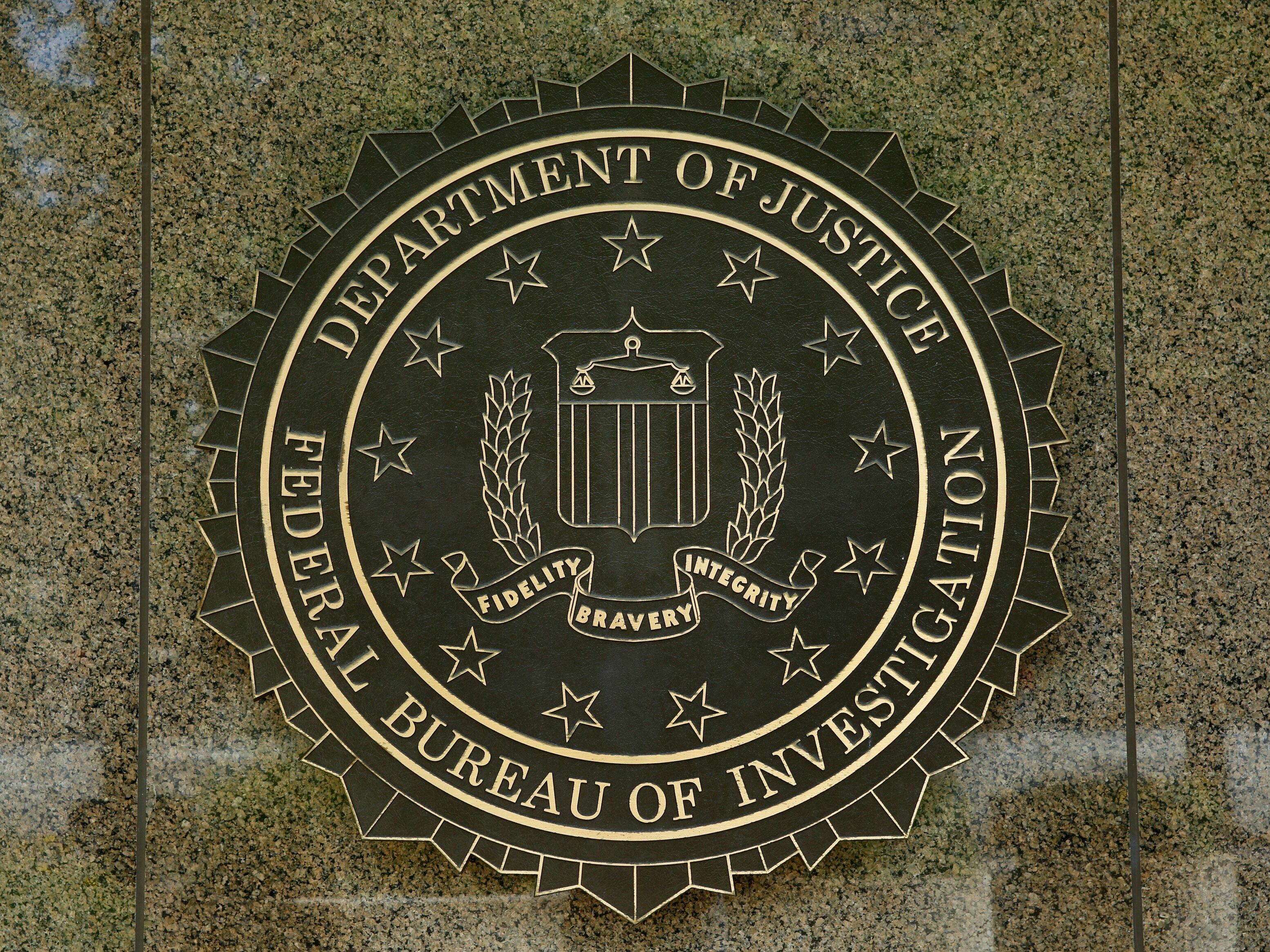 caption: The FBI seal is seen outside the headquarters building in Washington, D.C. in 2016.
