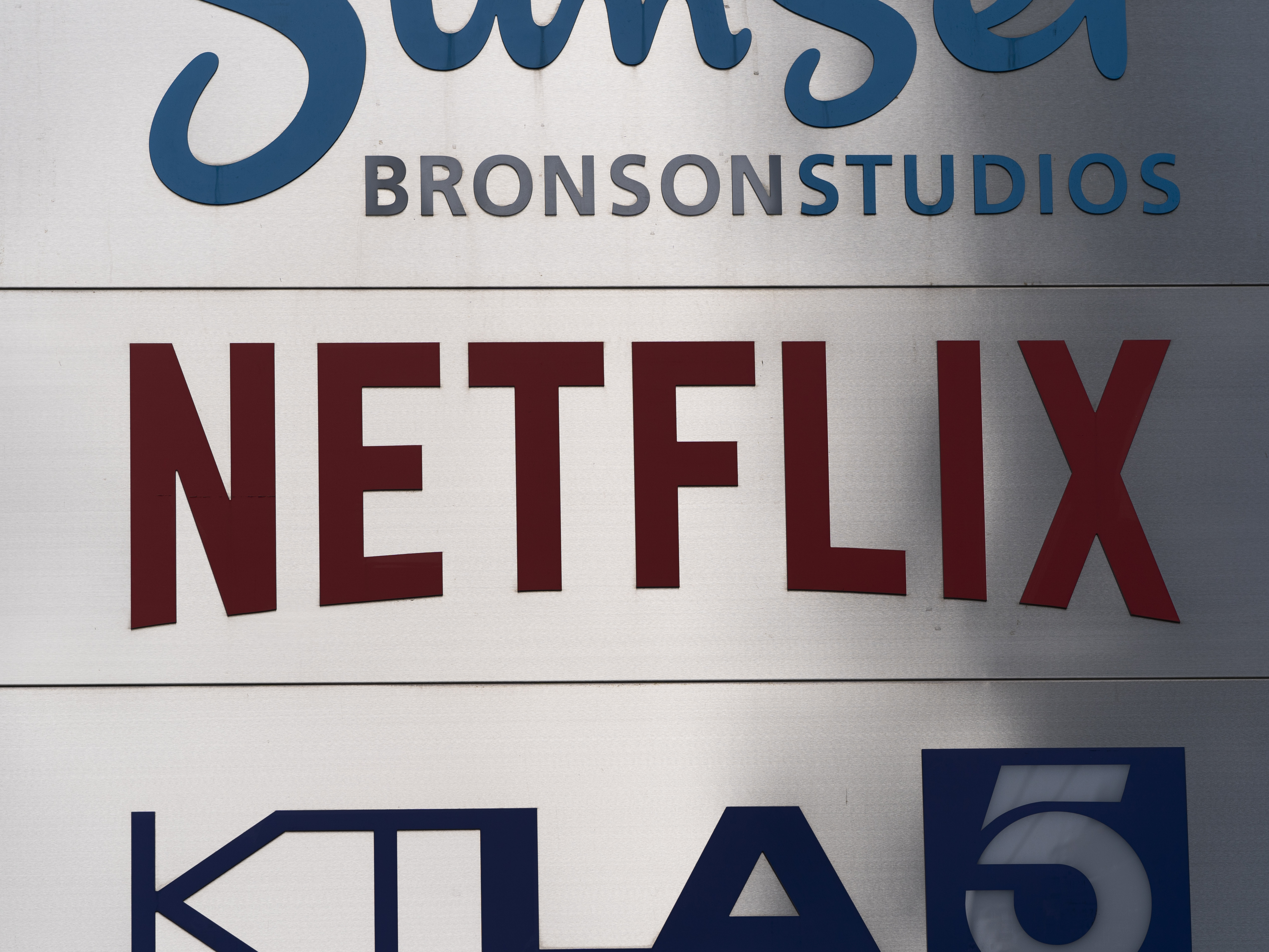 caption: Netflix sign is photographed outside its office building in Los Angeles, Wednesday, April 20, 2022.