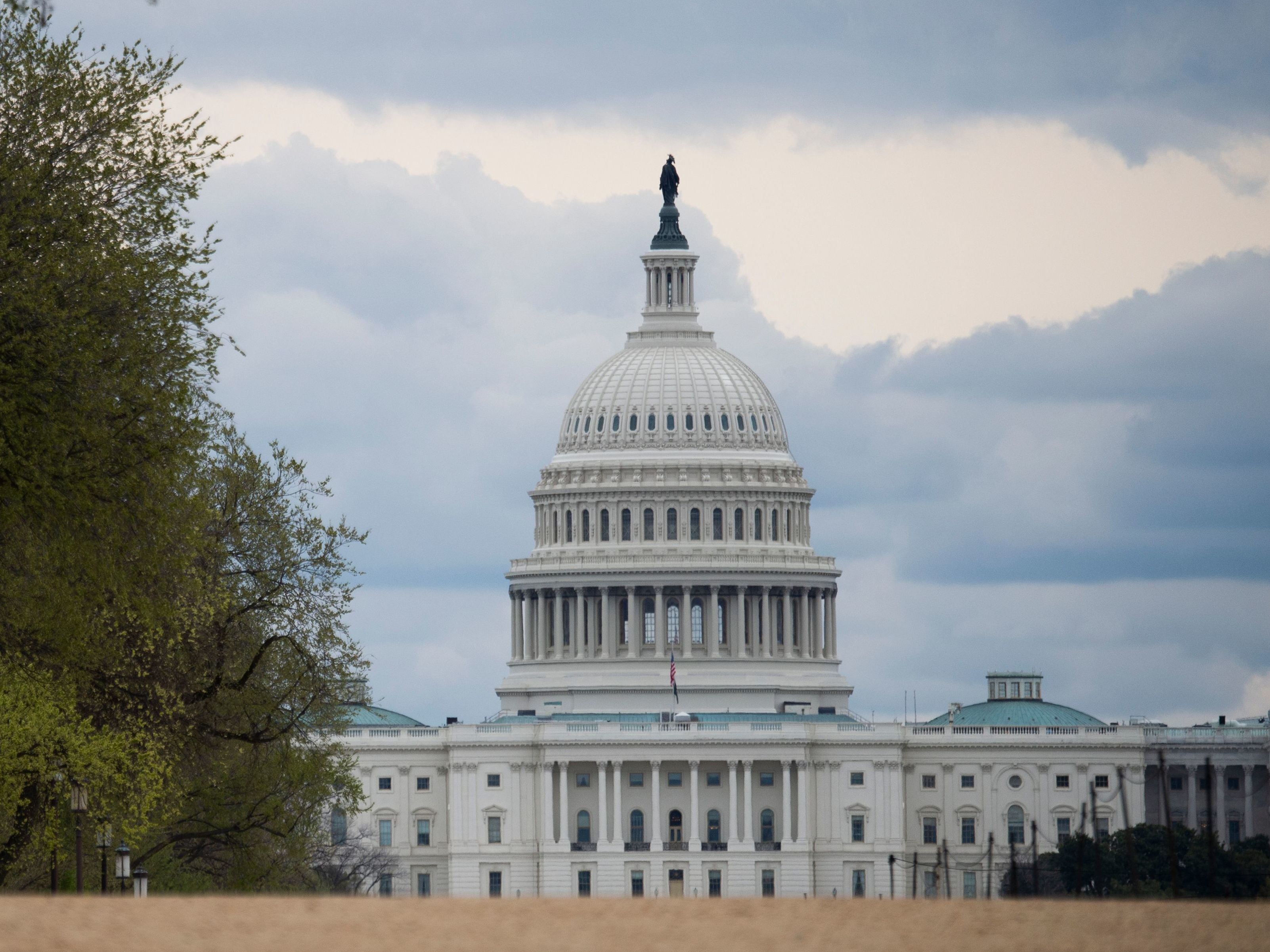 caption: The U.S. Capitol is seen on March 31. Lobbyists are competing for funds in coronavirus financial aid.